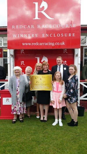 Julie Peary and family with the Golden Ticket at Redcar Racecourse Zetland Gold Cup day